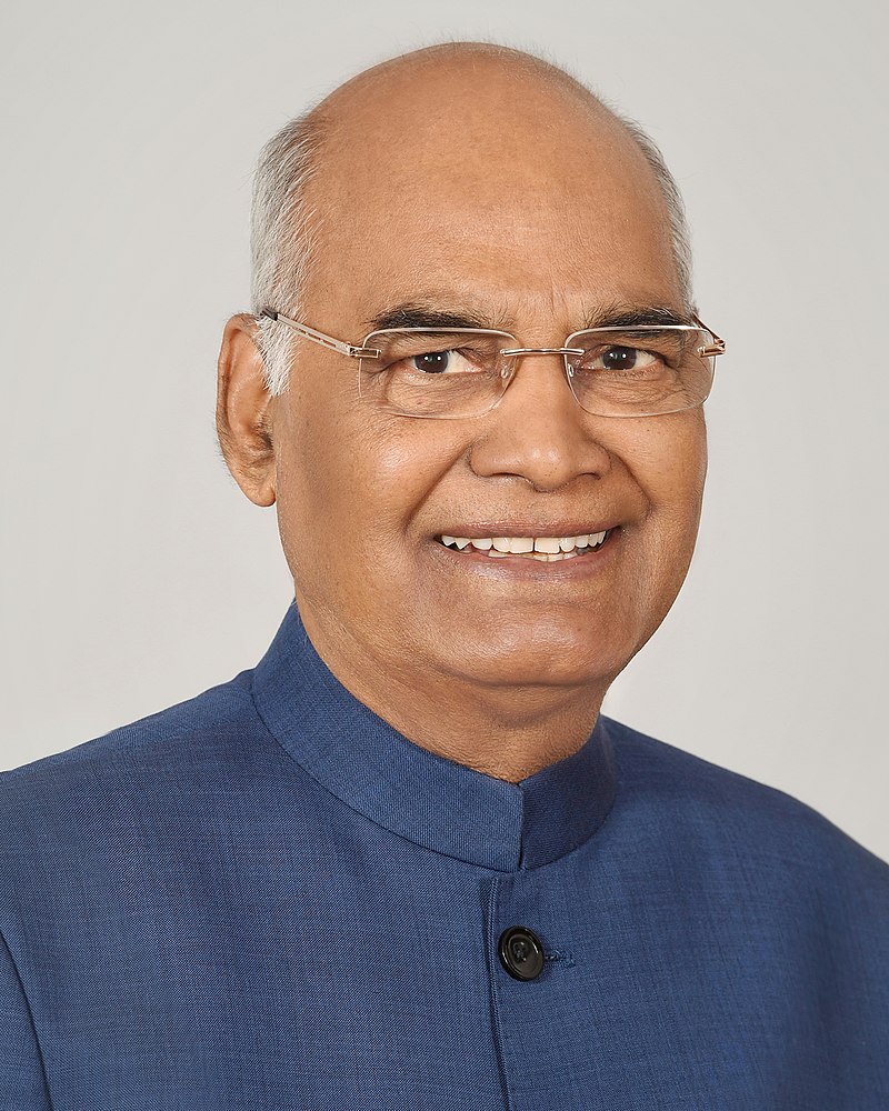 Head shot of Kovind smiling. He is wearing a blue suit jacket.