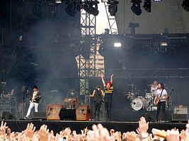 My Chemical Romance performing on stage.