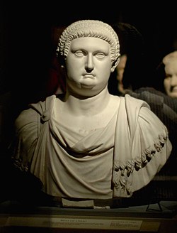 Bust depicting a man with a full head of hair wearing a Roman tunic