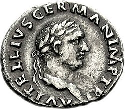 Grey coin depicting a male face staring right