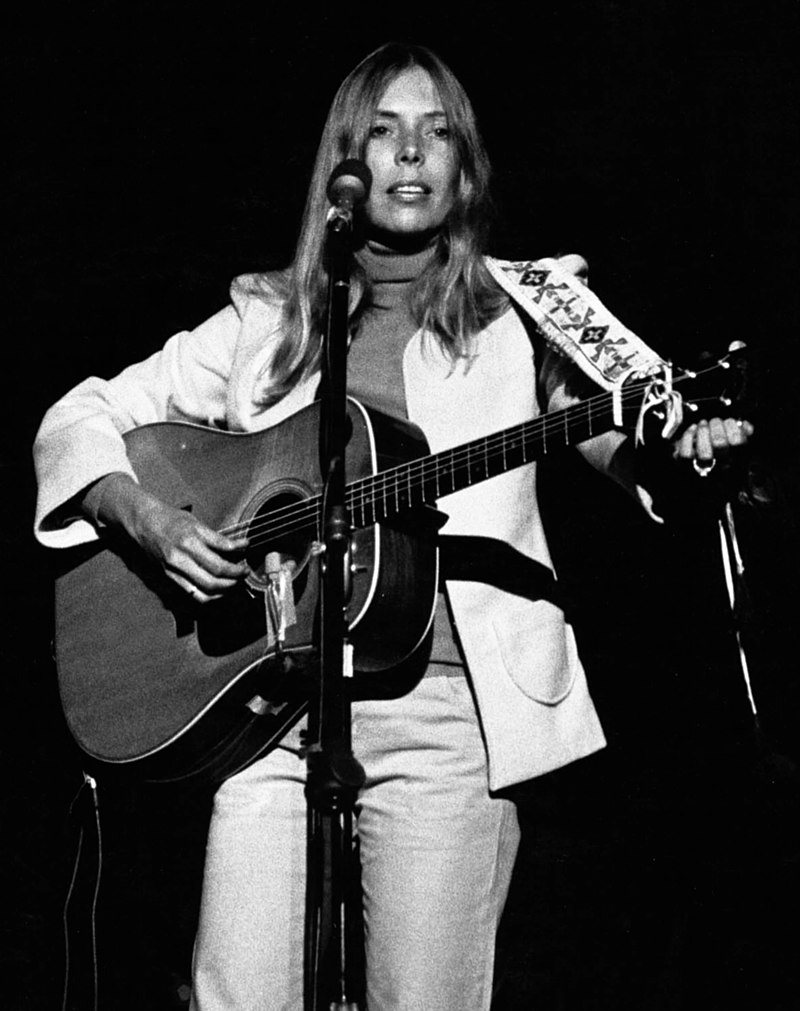 Mitchell performing in concert at the Universal Amphitheatre in August 1974